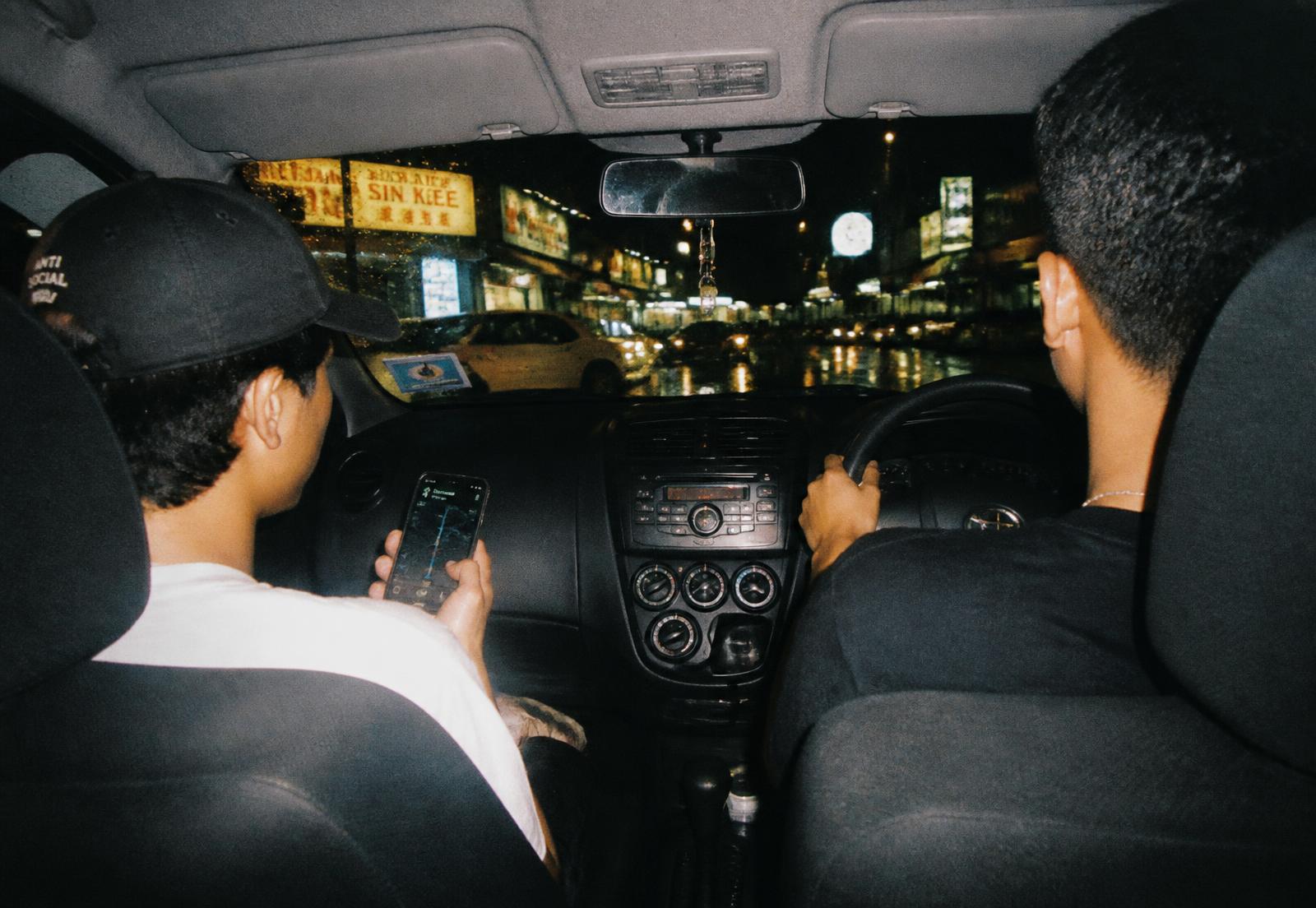 Friends in a car still deciding where to eat